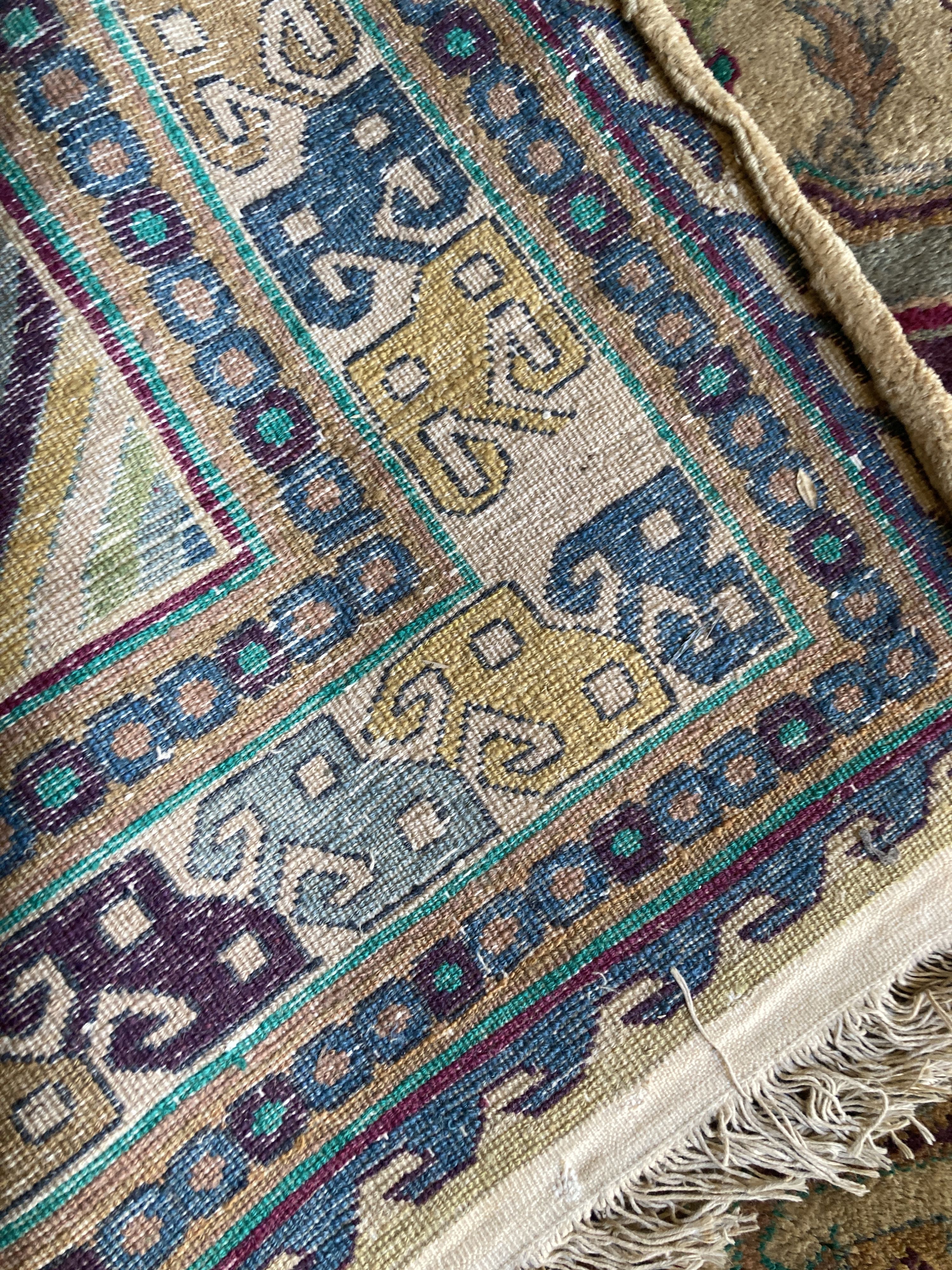 A Caucasian design fawn ground rug, 242 x 156cm